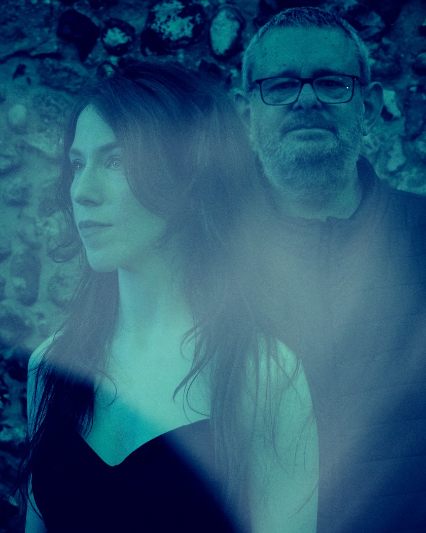 Blue-toned double exposure portrait of .astriDrift